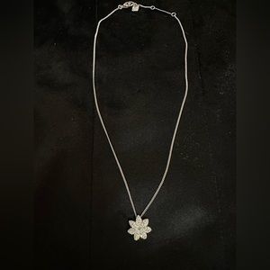 Swarovski crystal flower pendant on 16 inch sterling silver chain.